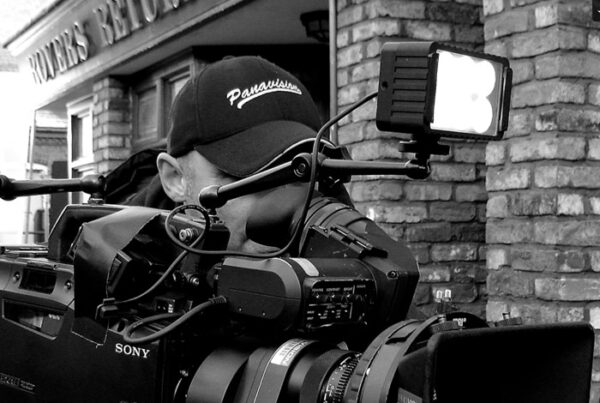 web design screenshot - man with camera